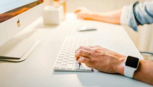 person using iMac