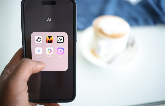 a person holding a cell phone in their hand