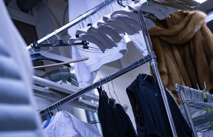 a clothes rack with clothes hanging on it