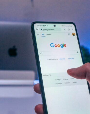 person holding white android smartphone