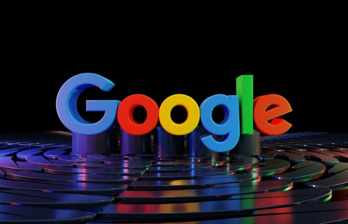the google logo is displayed in front of a black background