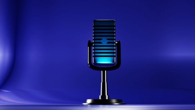 A microphone on a stand on a blue background