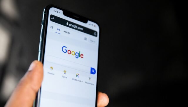 person holding black android smartphone